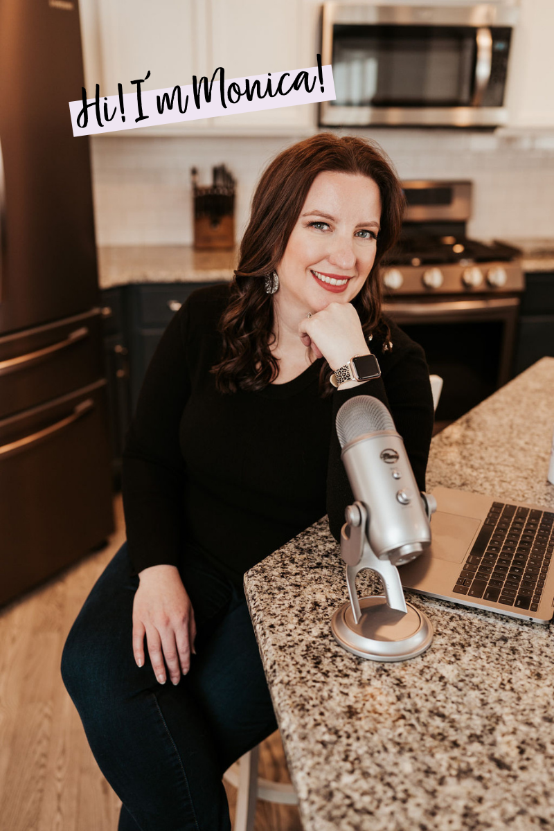 woman sitting talking into microphone